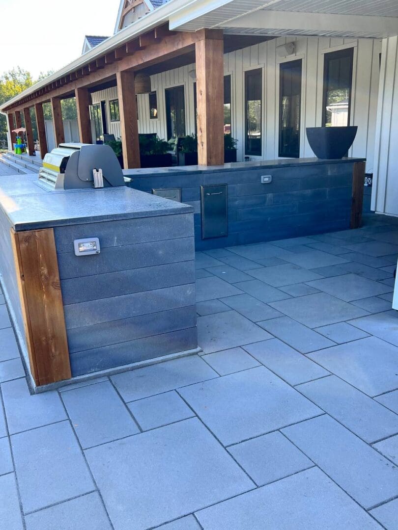 A large outdoor grill sitting on top of a patio.