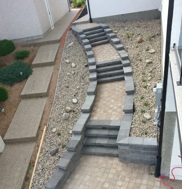 A walkway with steps leading to the ground.
